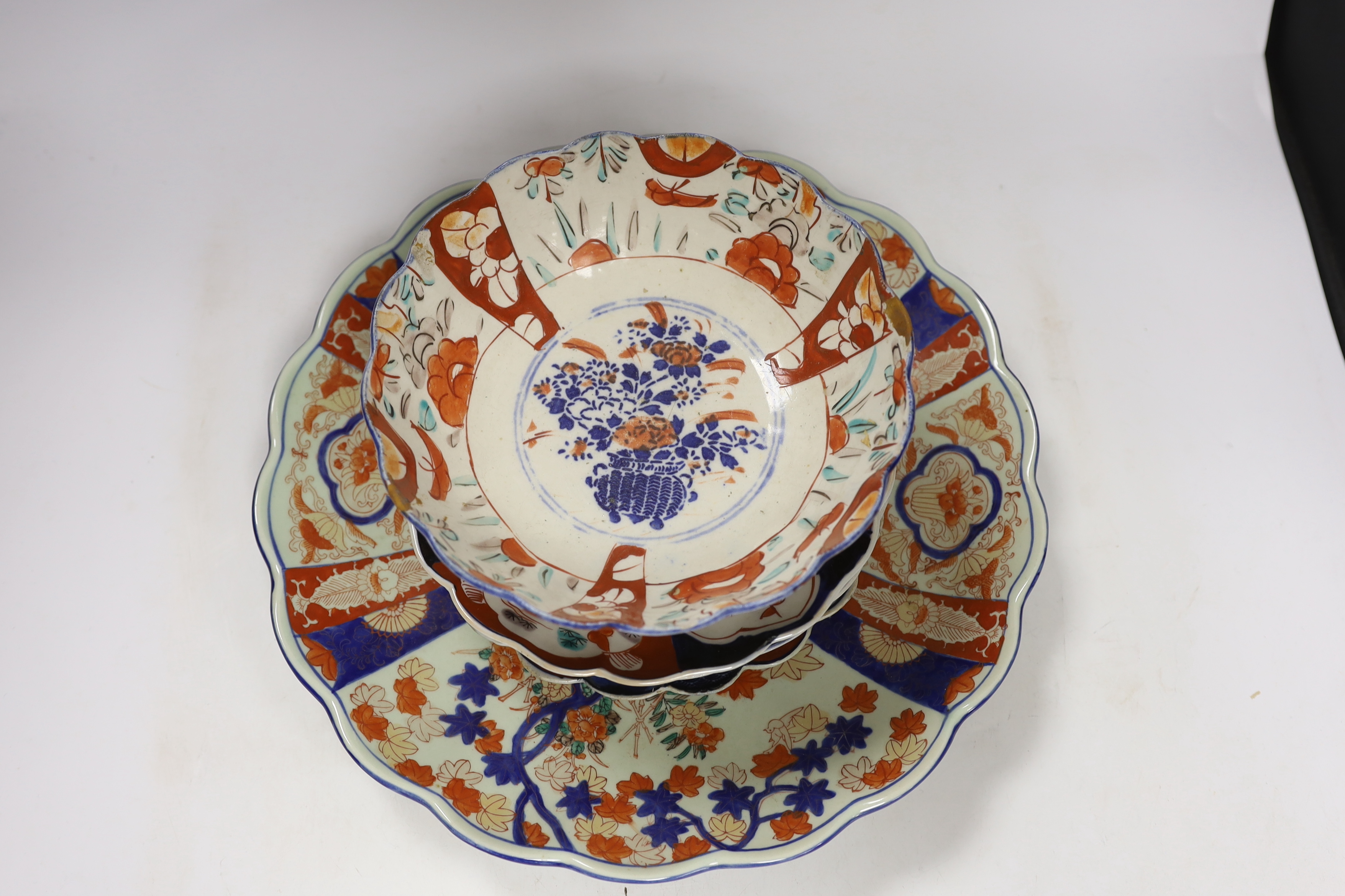 A group of Imari wares comprising bowl, charger and three dishes, largest 37cm in diameter